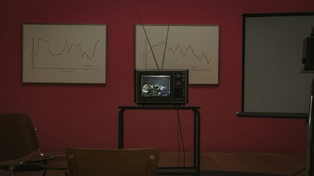 Vision mixer desk with multiple live preview screens in a television gallery