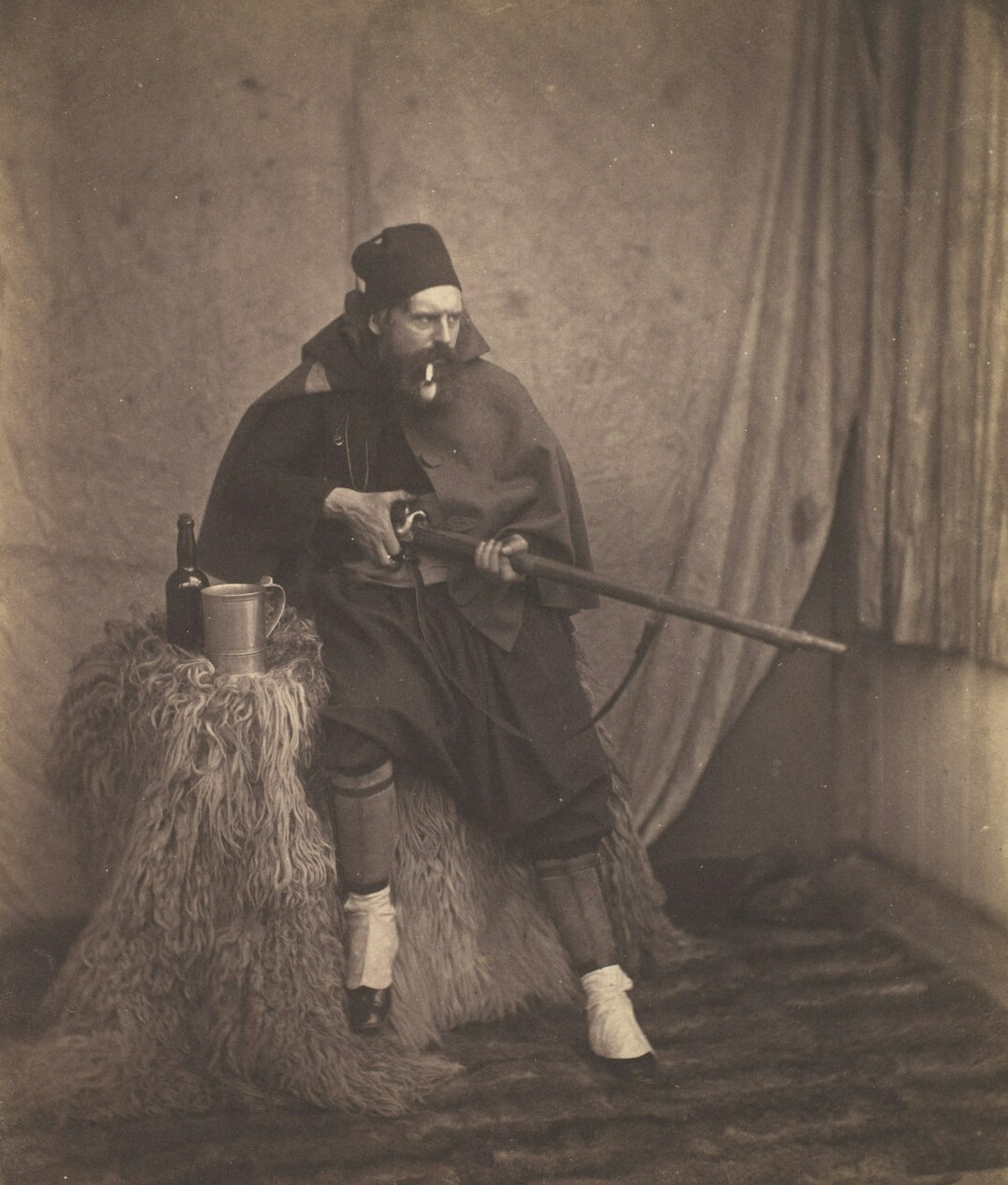 Studio portrait of a young British man with short beard wearing a casual jacket