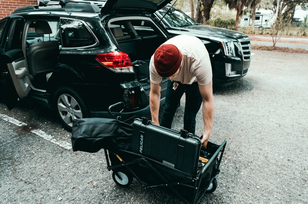 Broadcast engineers setting up outside broadcast van equipment for a live event